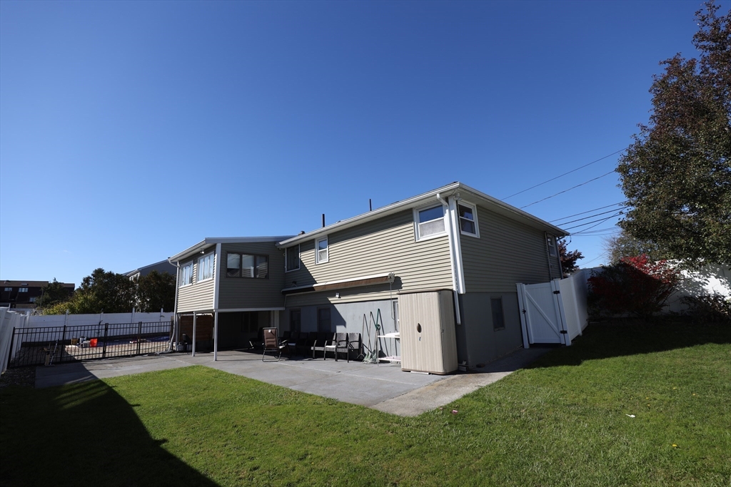 45 Assunta Road Revere, MA 02151 - Photo 3 of 19 a car parked in front of house with a yard