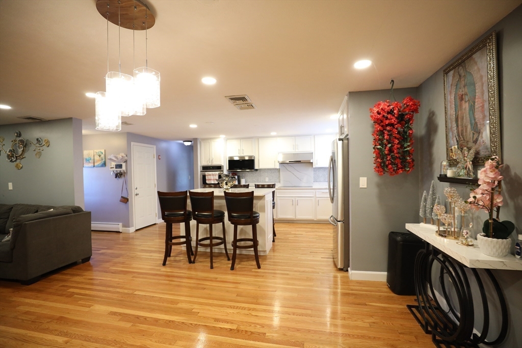 45 Assunta Road Revere, MA 02151 - Photo 7 of 19 a view of kitchen with cabinets and wooden floor