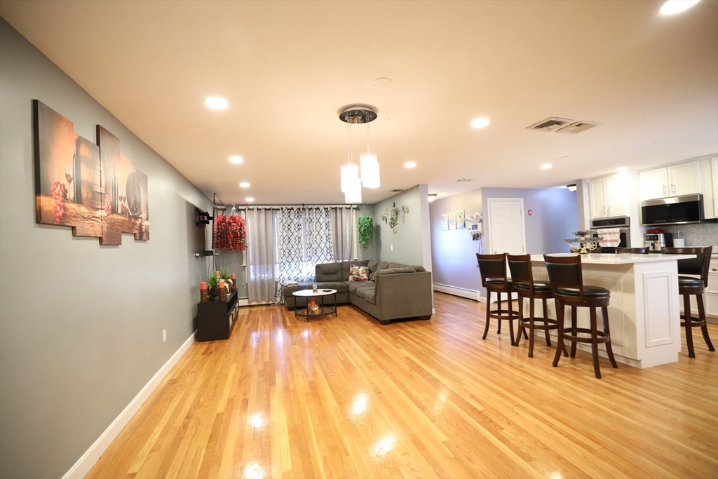 45 Assunta Road Revere, MA 02151 - Photo 8 of 19 a view of a dining room with furniture and wooden floor