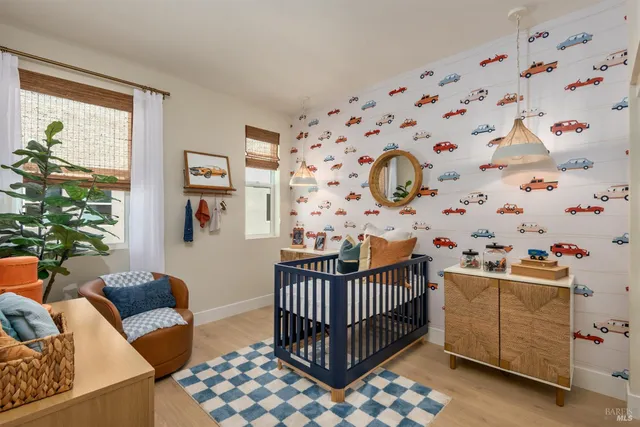 a bedroom with furniture and a window