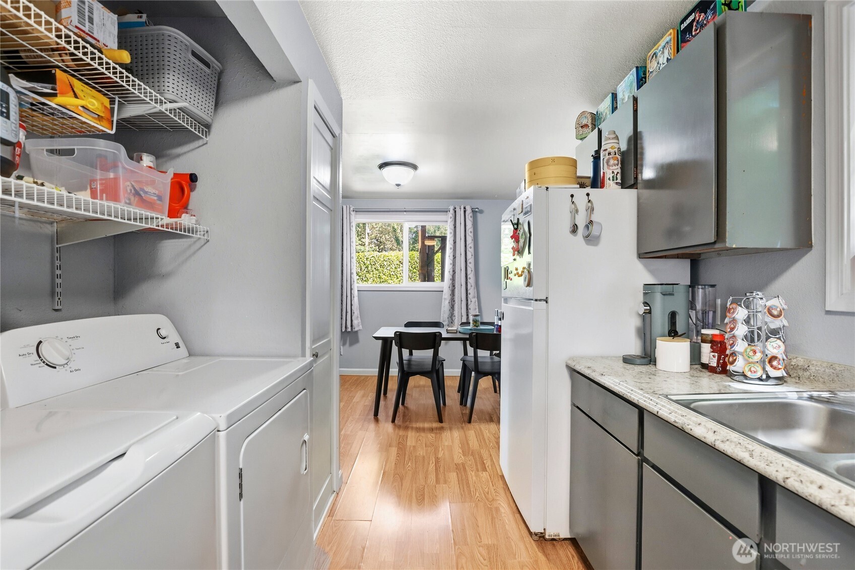 2533 Fir Avenue Bremerton, WA 98310 - Photo 13 of 38 a view of a kitchen with furniture and wooden floor
