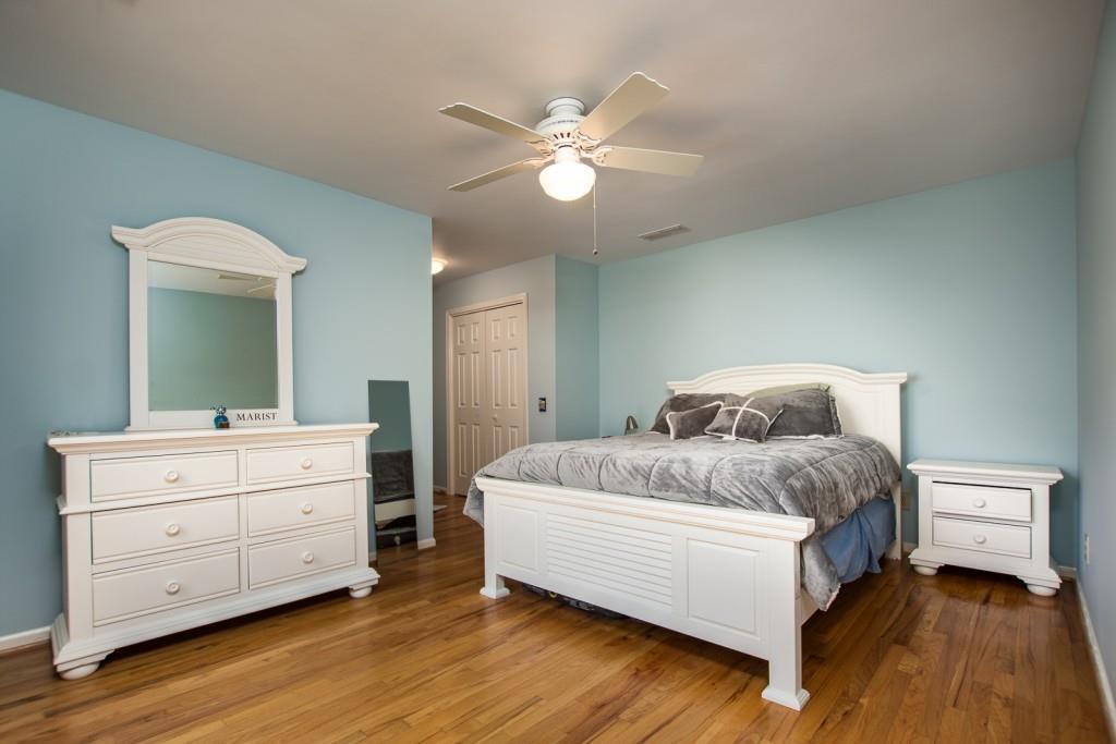 1106 Byrnwyck Road Northeast Brookhaven, GA 30319 - Photo 17 of 41 a spacious bedroom with a bed and a dresser