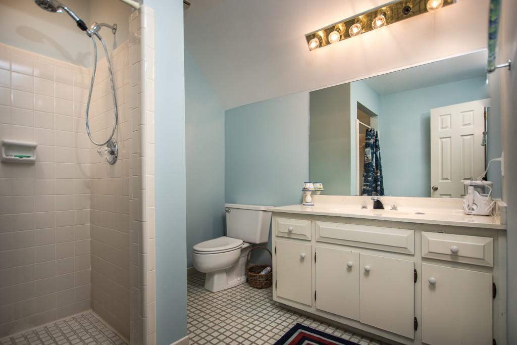 1106 Byrnwyck Road Northeast Brookhaven, GA 30319 - Photo 18 of 41 a bathroom with a sink a toilet and shower