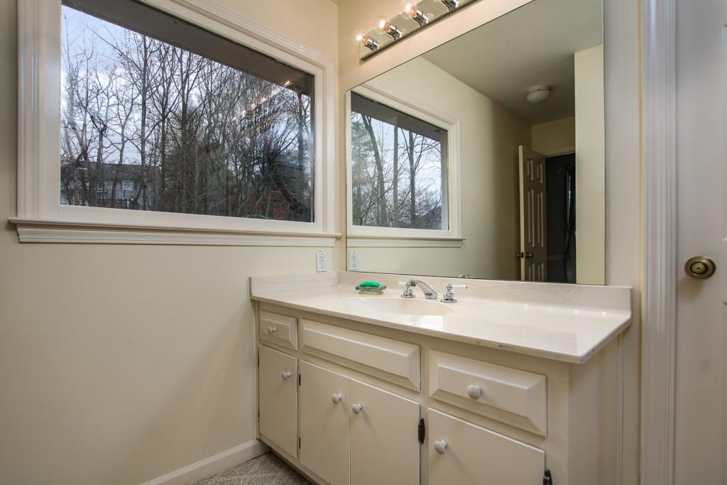 1106 Byrnwyck Road Northeast Brookhaven, GA 30319 - Photo 29 of 41 a bathroom with a sink and a mirror