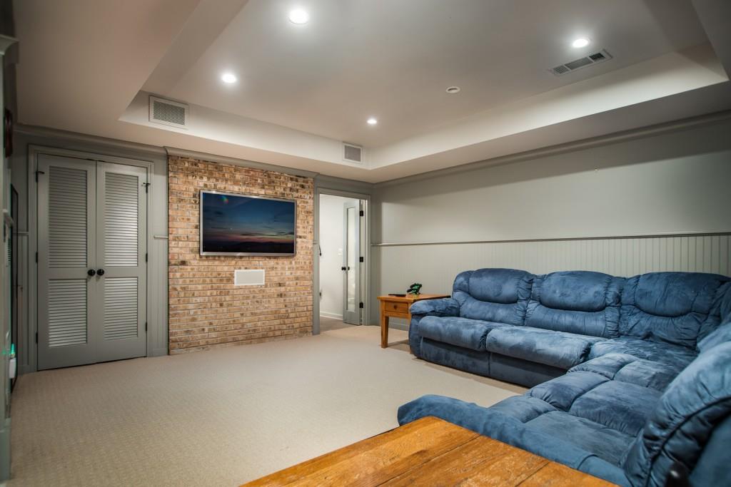 1106 Byrnwyck Road Northeast Brookhaven, GA 30319 - Photo 36 of 41 a living room with furniture and a flat screen tv
