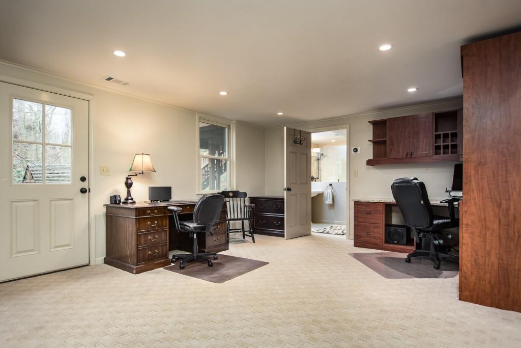 1106 Byrnwyck Road Northeast Brookhaven, GA 30319 - Photo 40 of 41 a living room with furniture a computer on desk and chair