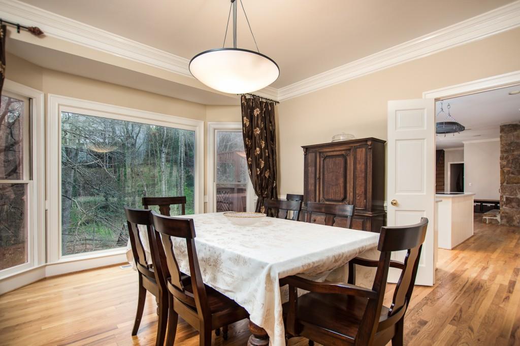 1106 Byrnwyck Road Northeast Brookhaven, GA 30319 - Photo 5 of 41 a view of a dining room with furniture window and wooden floor