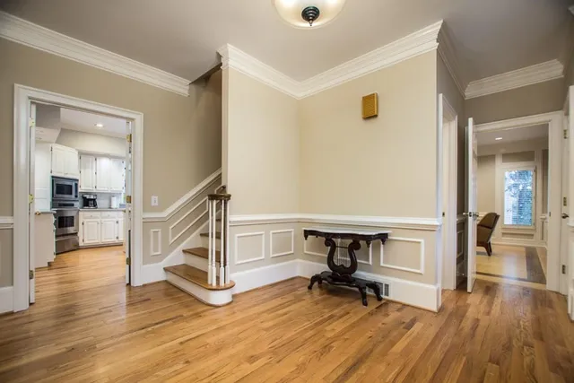 a bathroom with a sink mirror and toilet
