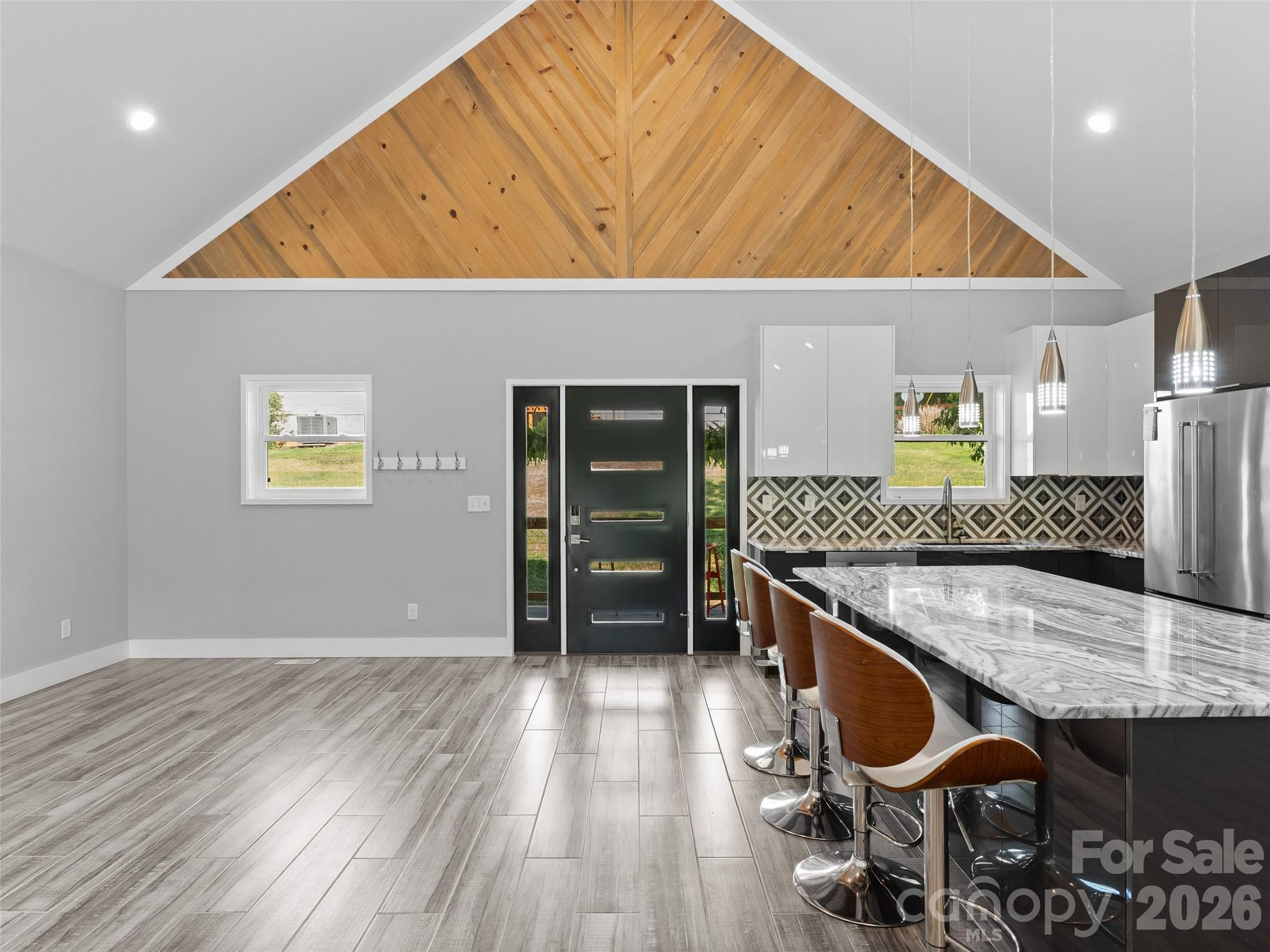 123 Israel Road Candler, NC 28715 - Photo 11 of 44 a view of kitchen island with wooden floor