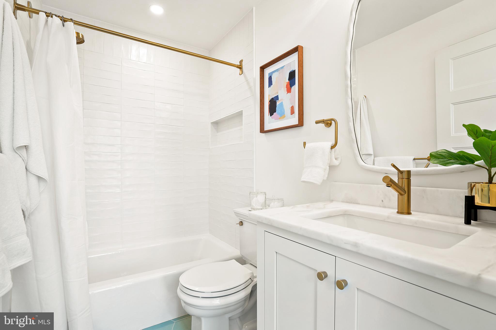 240 11th Street Northeast Washington, DC 20002 - Photo 17 of 32 a bathroom with a sink and a mirror