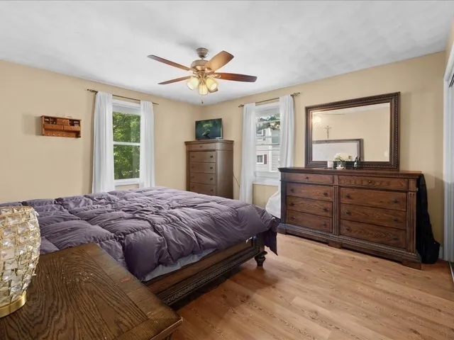 a bedroom with a bed and a dresser