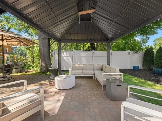 a patio view with patio furniture and garden
