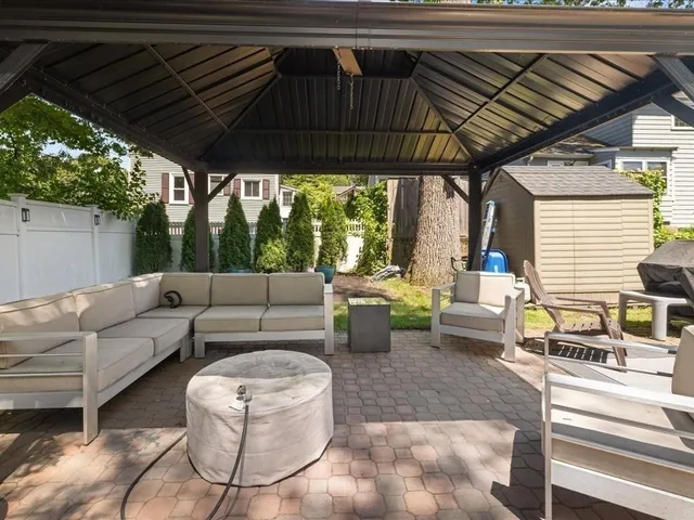 a outdoor living space with patio furniture and a potted plant