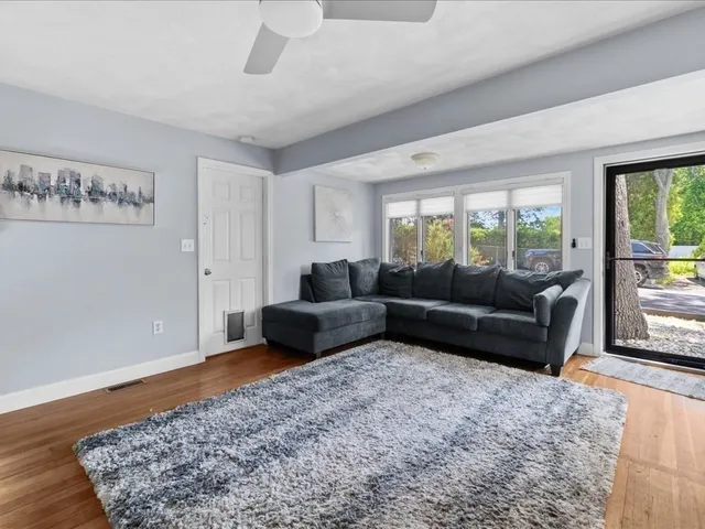 a living room with furniture and a rug