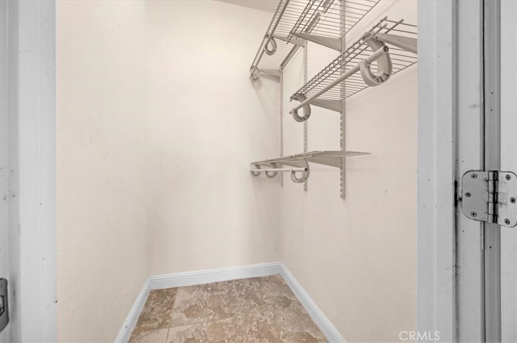 3271 East Muscat Avenue Fresno, CA 93725 - Photo 16 of 53 a view of small space with racks on the wall