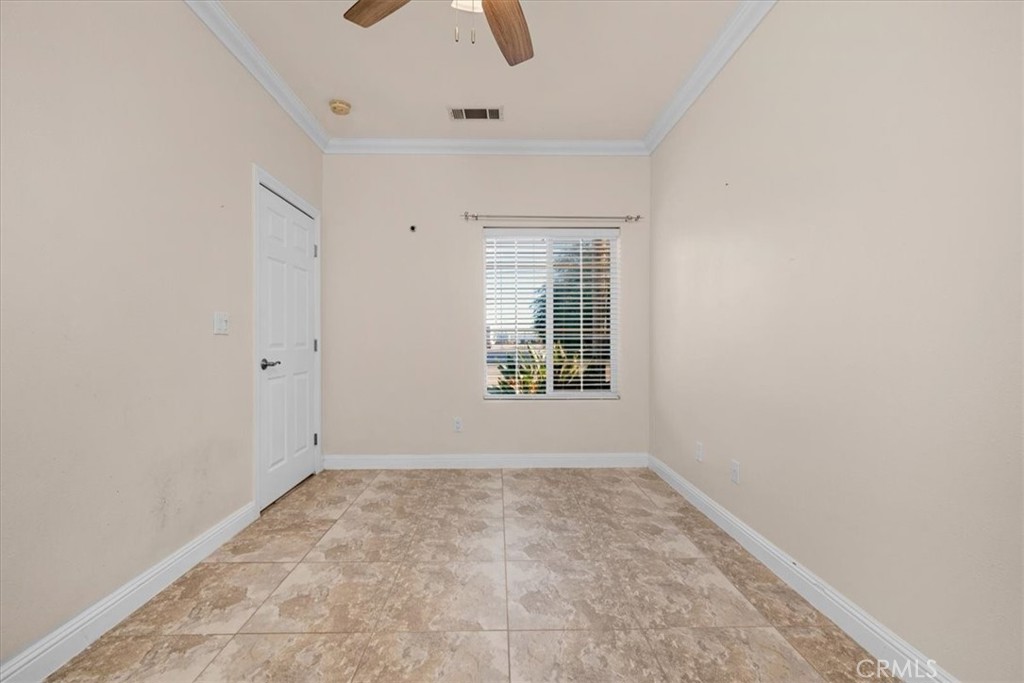 3271 East Muscat Avenue Fresno, CA 93725 - Photo 17 of 53 an empty room with windows