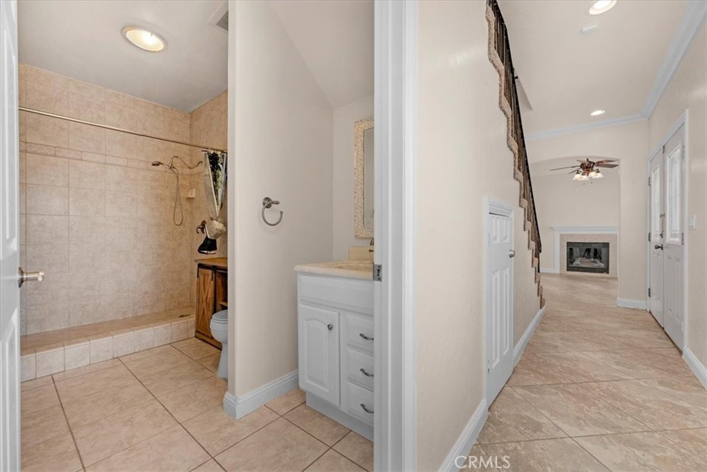 3271 East Muscat Avenue Fresno, CA 93725 - Photo 18 of 53 a bathroom with a shower and a glass door
