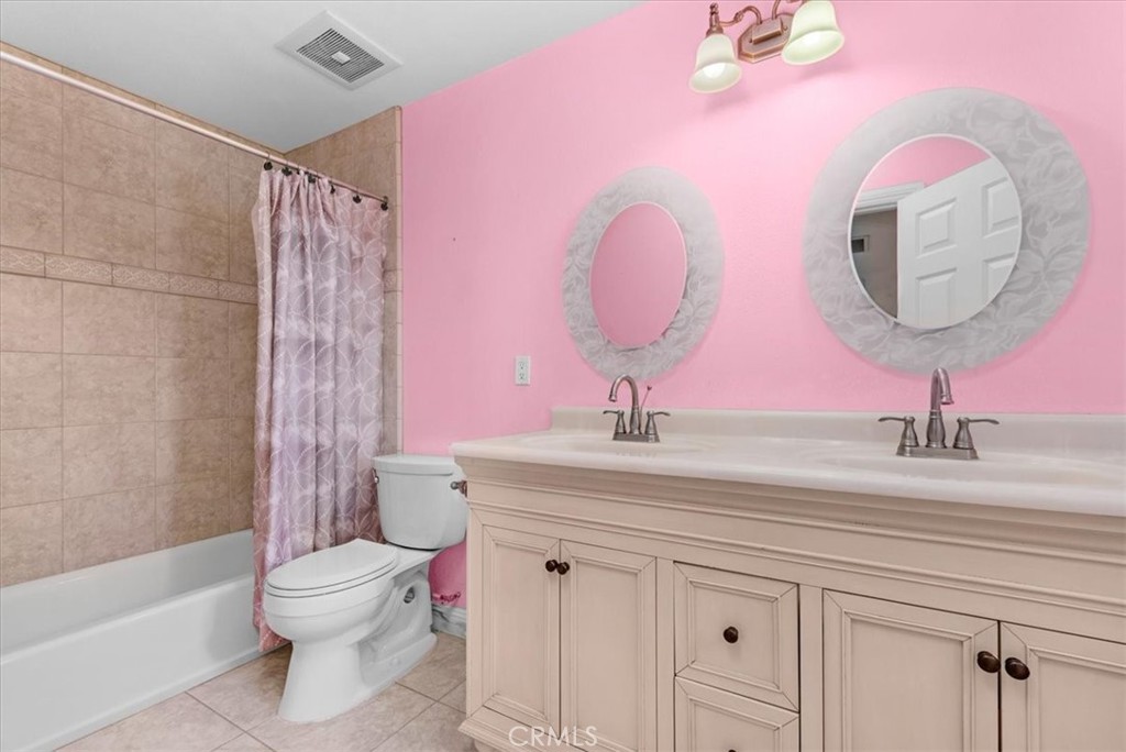 3271 East Muscat Avenue Fresno, CA 93725 - Photo 26 of 53 a bathroom with a granite countertop sink mirror and toilet