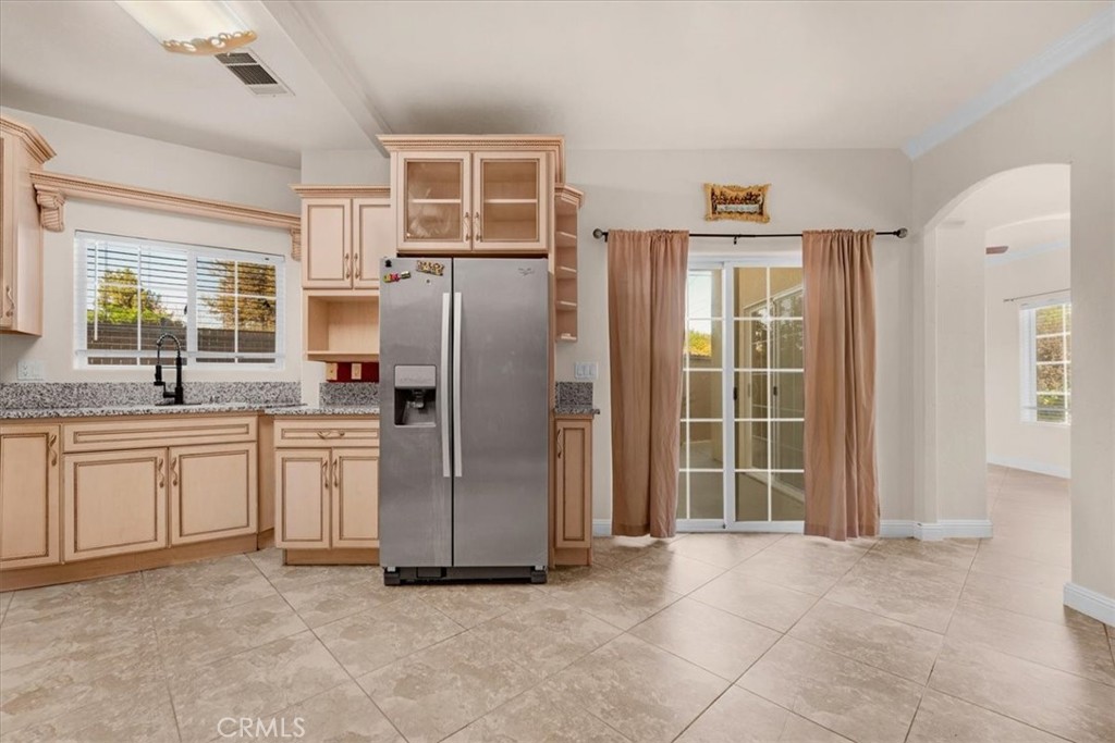 3271 East Muscat Avenue Fresno, CA 93725 - Photo 3 of 53 a kitchen with stainless steel appliances granite countertop a refrigerator and a sink