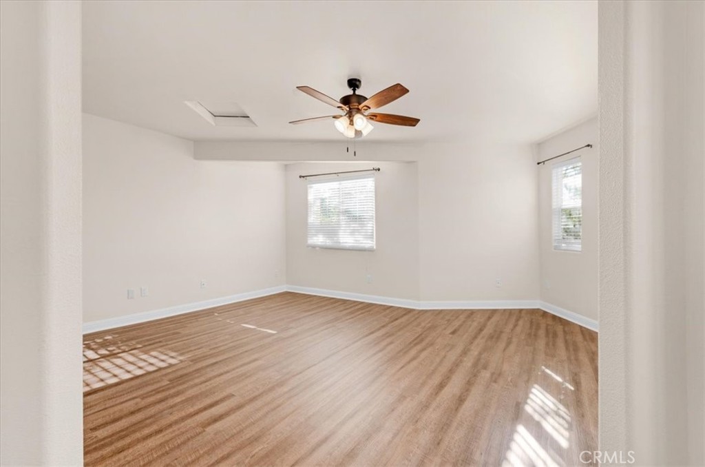 3271 East Muscat Avenue Fresno, CA 93725 - Photo 31 of 53 an empty room with windows and fan