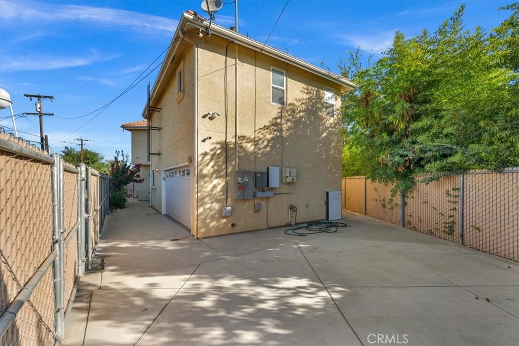 3271 East Muscat Avenue Fresno, CA 93725 - Photo 36 of 53 a view of a house with a yard