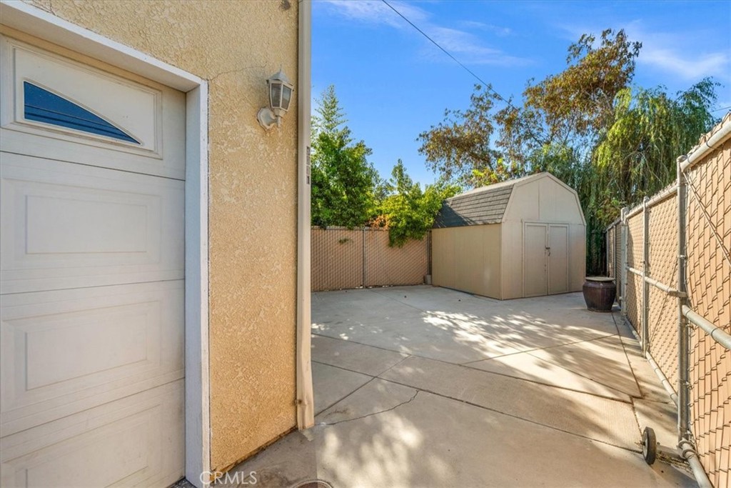 3271 East Muscat Avenue Fresno, CA 93725 - Photo 37 of 53 a view of a house with a yard and tree