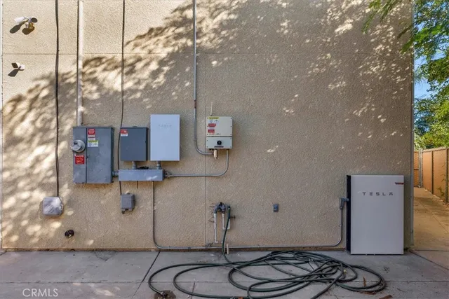 a view of a white house with a yard and plants
