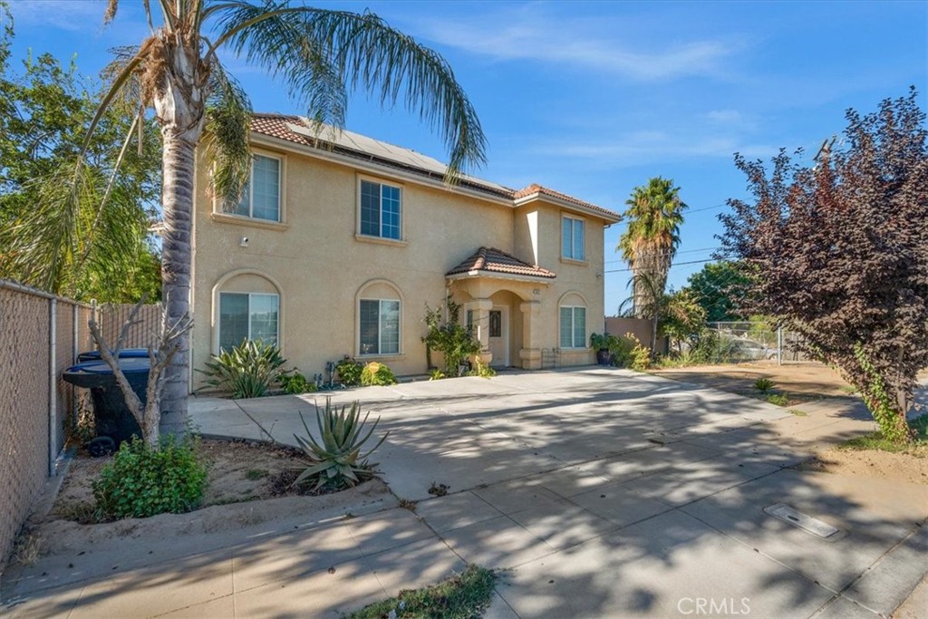 3271 East Muscat Avenue Fresno, CA 93725 - Photo 42 of 53 a front view of a house with a yard