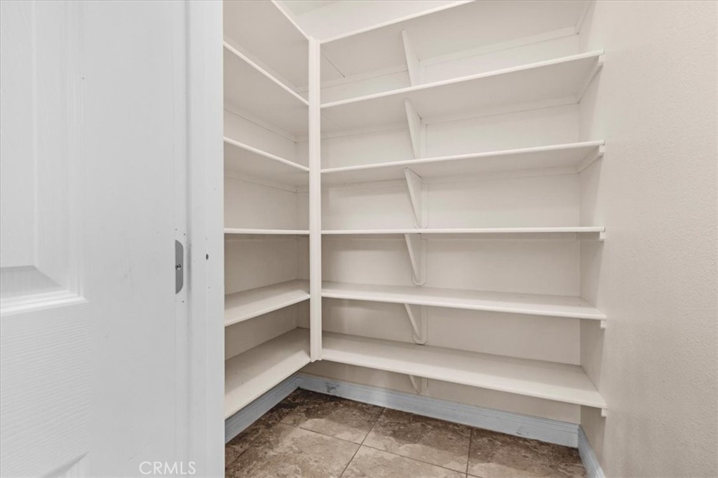 3271 East Muscat Avenue Fresno, CA 93725 - Photo 7 of 53 a view of walk in closet with empty racks
