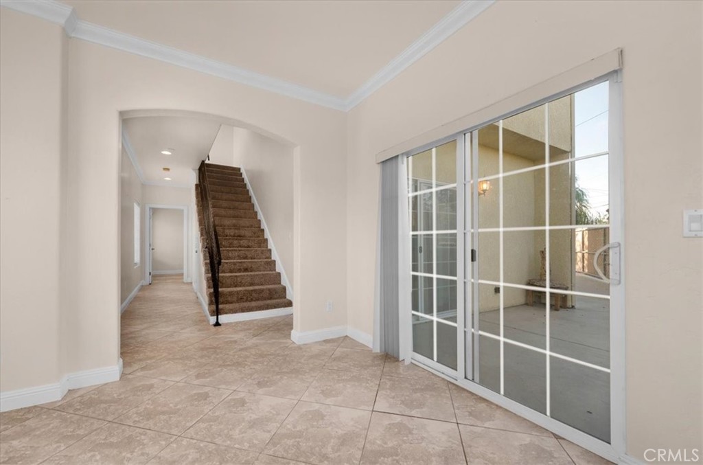 3271 East Muscat Avenue Fresno, CA 93725 - Photo 9 of 53 an empty room with windows