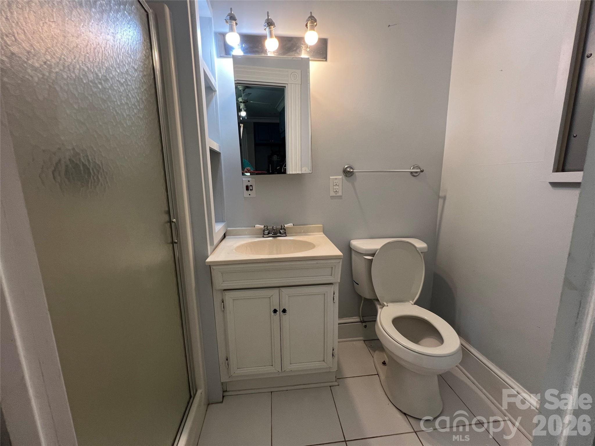 171 North Mitchell Street Rutherfordton, NC 28139 - Photo 16 of 29 a bathroom with a toilet sink and mirror