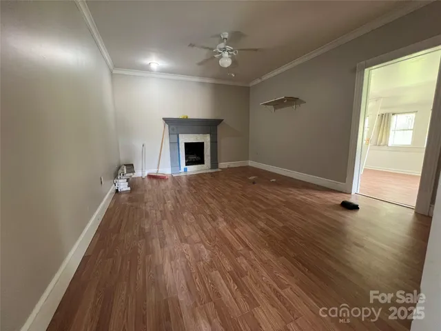 a view of livingroom with hardwood floor and a ceiling fan