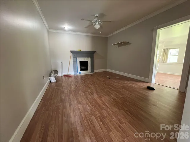 a view of livingroom with hardwood floor and a ceiling fan