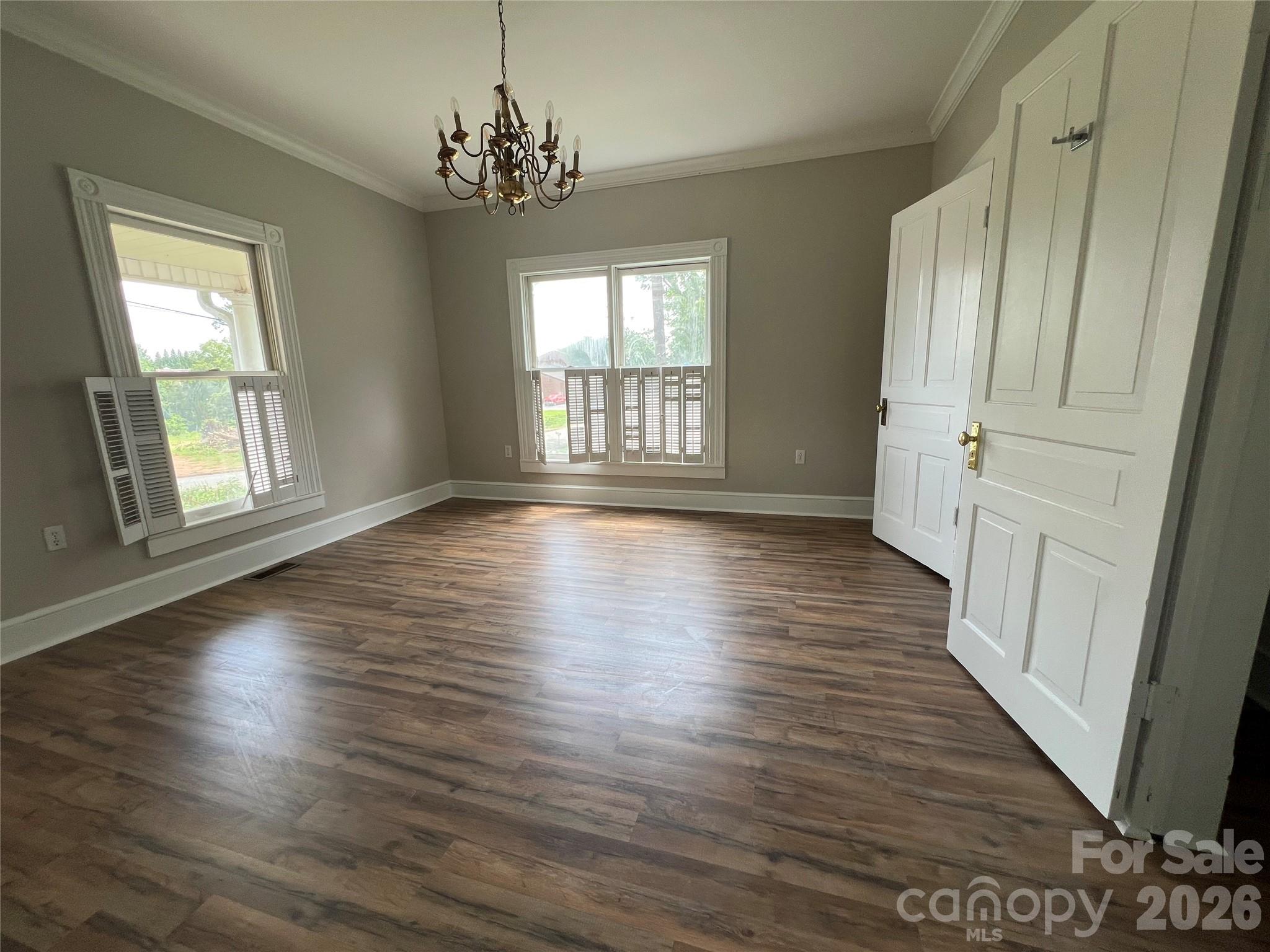 171 North Mitchell Street Rutherfordton, NC 28139 - Photo 19 of 29 an empty room with wooden floor and windows