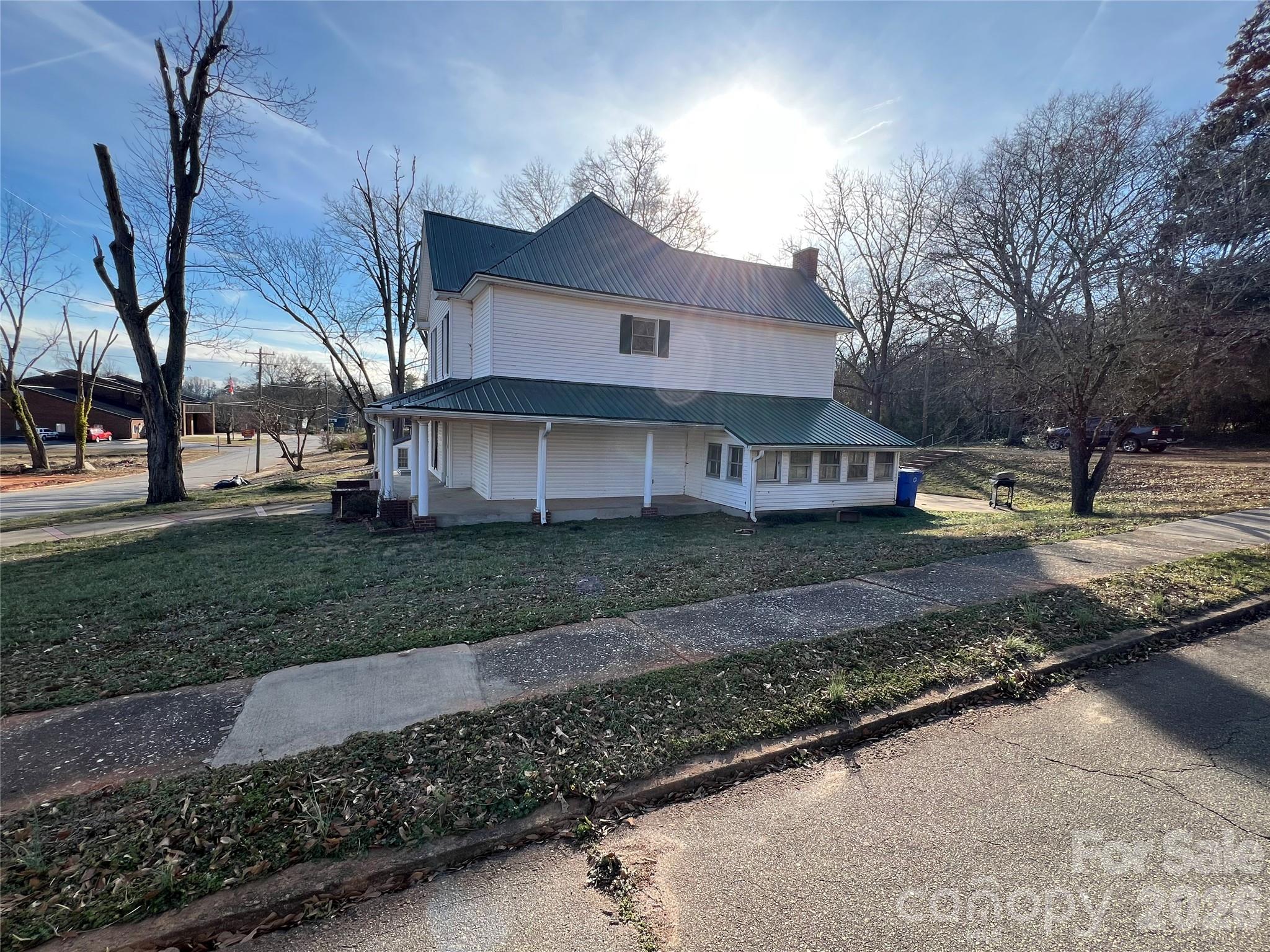 171 North Mitchell Street Rutherfordton, NC 28139 - Photo 3 of 29 a view of a big house with a yard and large tree