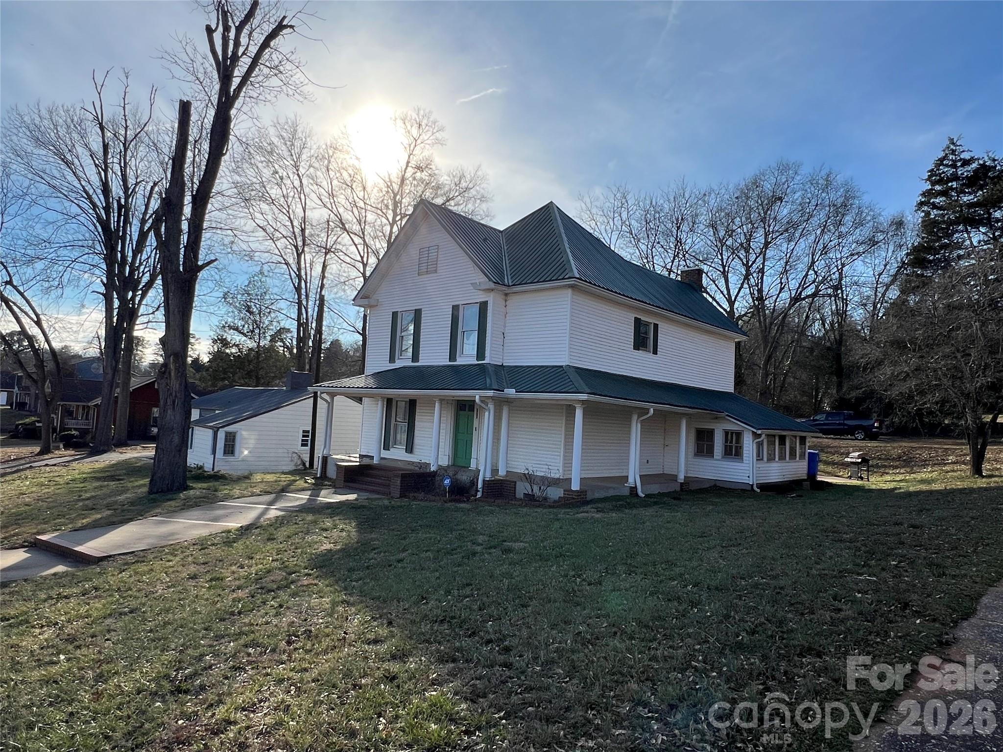 171 North Mitchell Street Rutherfordton, NC 28139 - Photo 5 of 29 a view of a house with a yard and large trees