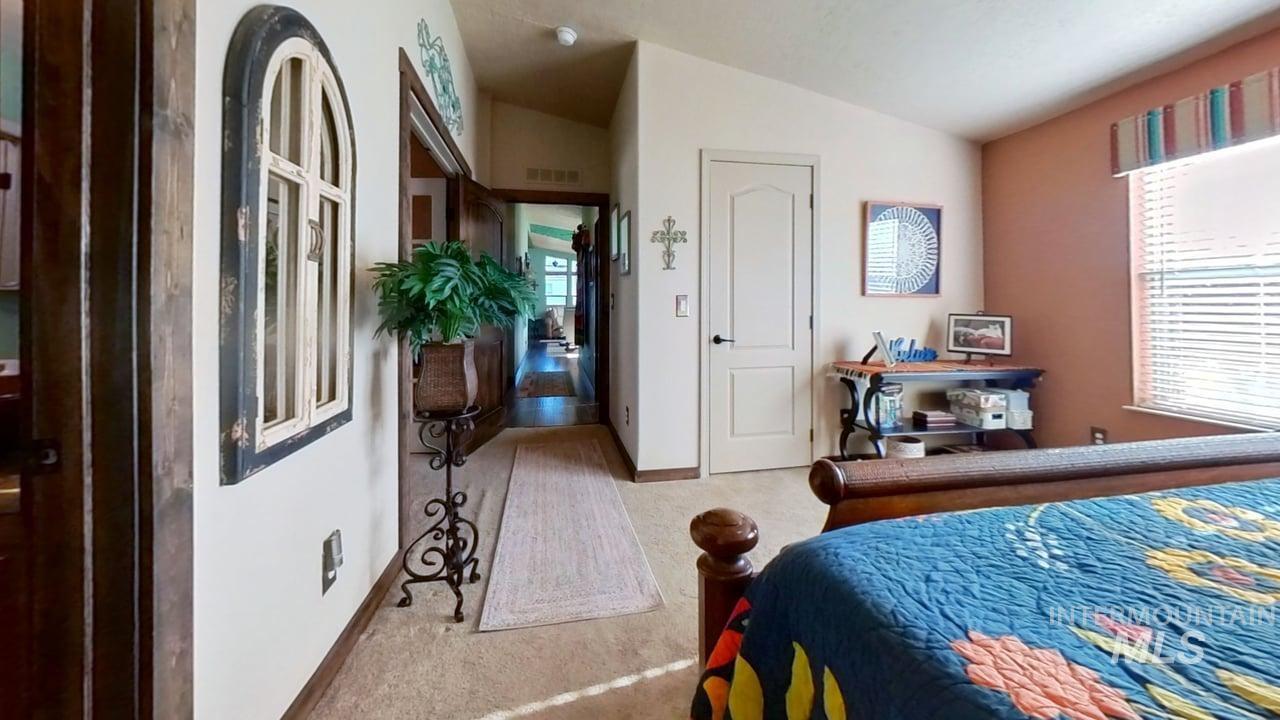 811 14th Street Clarkston, WA 99403 - Photo 23 of 50 Bedroom featuring lofted ceiling and baseboards