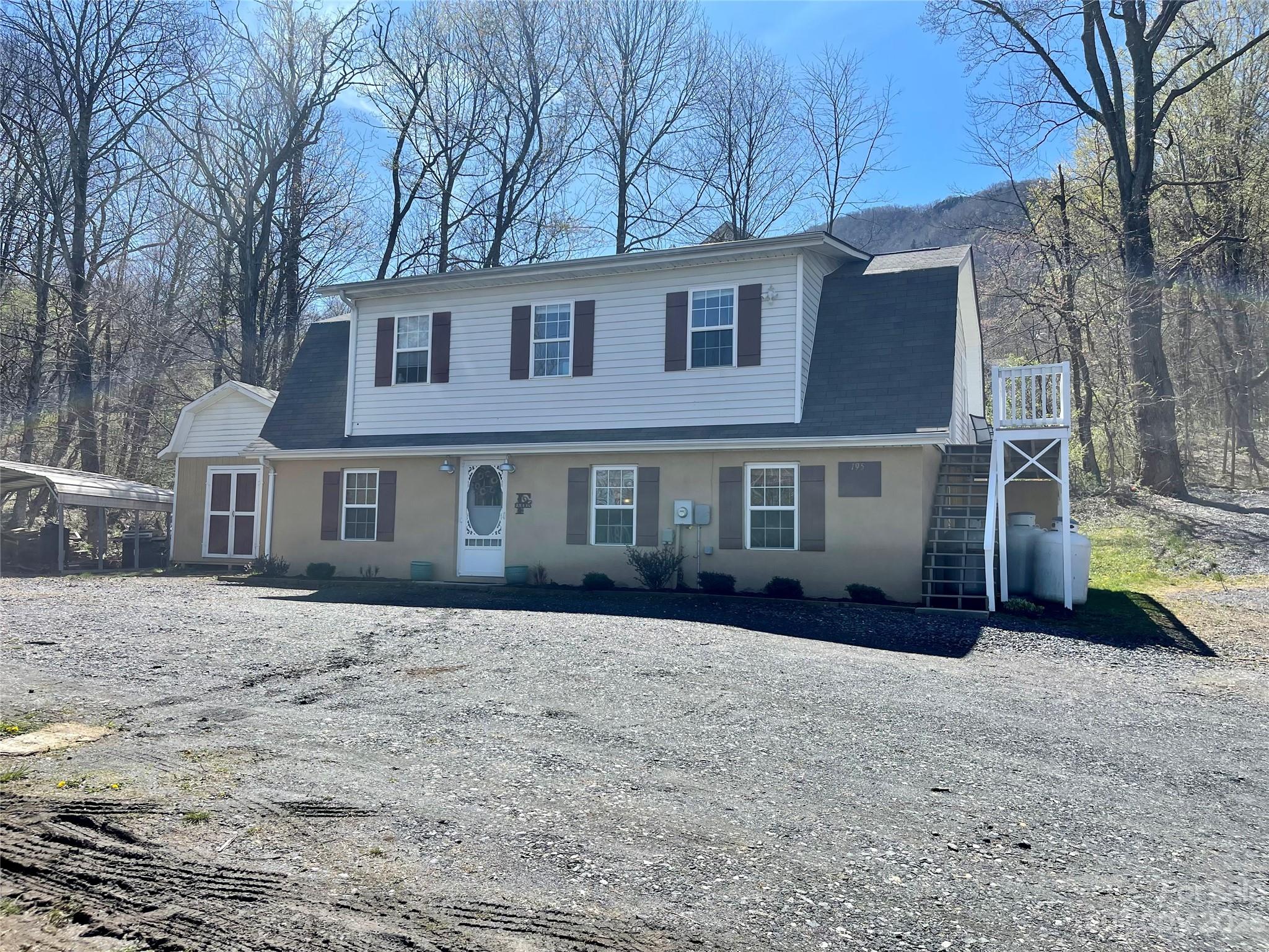 195 Trinity Lane Jefferson, NC 28640 - Photo 1 of 31 a front view of a house with a yard