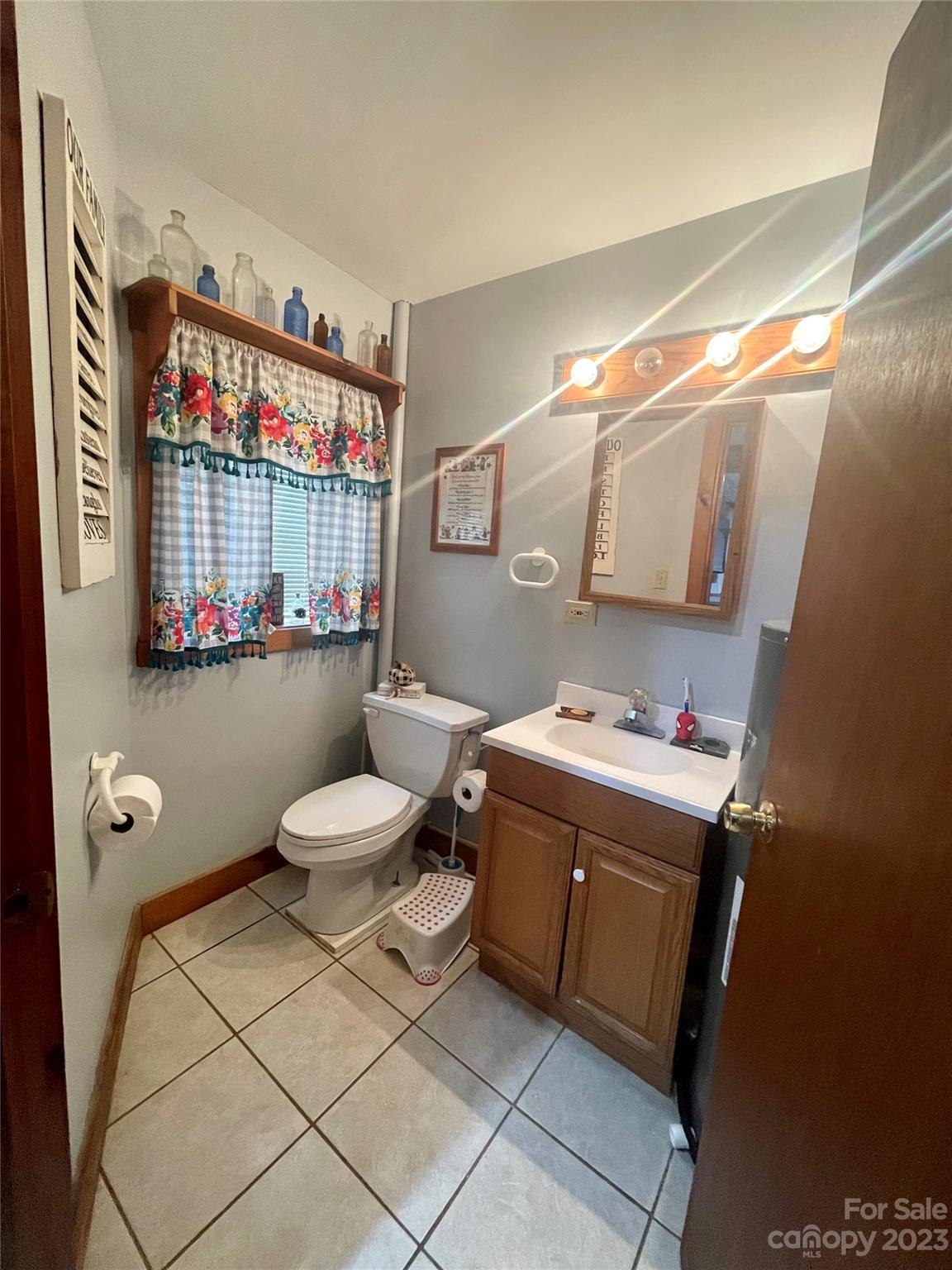 195 Trinity Lane Jefferson, NC 28640 - Photo 21 of 31 a bathroom with a sink a toilet and a shower