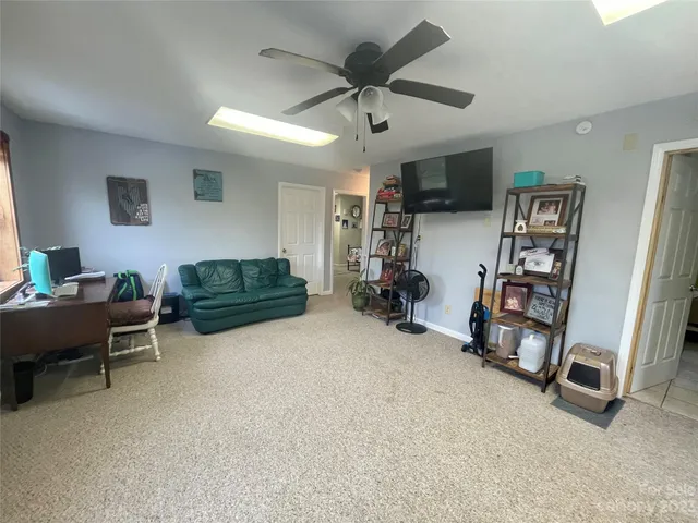 a bedroom with a bed and a dresser in it