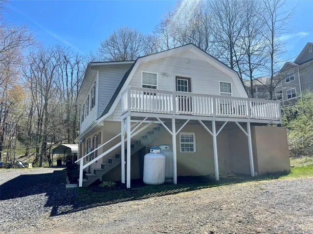 a front view of a house with parking