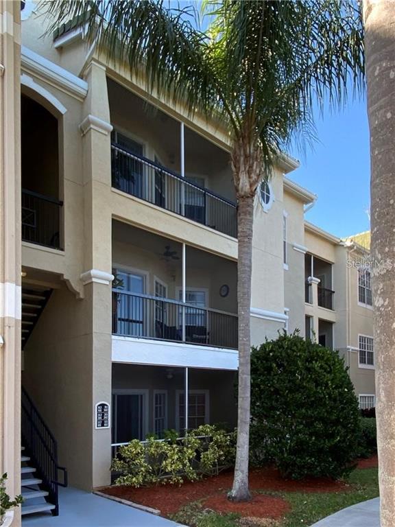 5174 Northridge Road, Unit 102 Sarasota, FL 34238 - Photo 1 of 1 a front view of a house with a garden