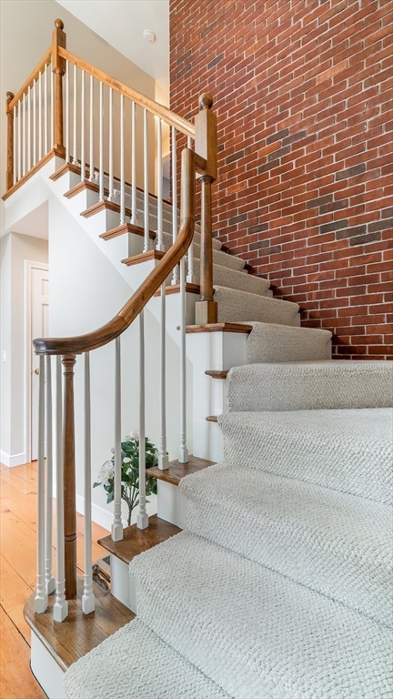 142 Baker Street Walpole, MA 02081 - Photo 7 of 42 a view of staircase with living room and stairs