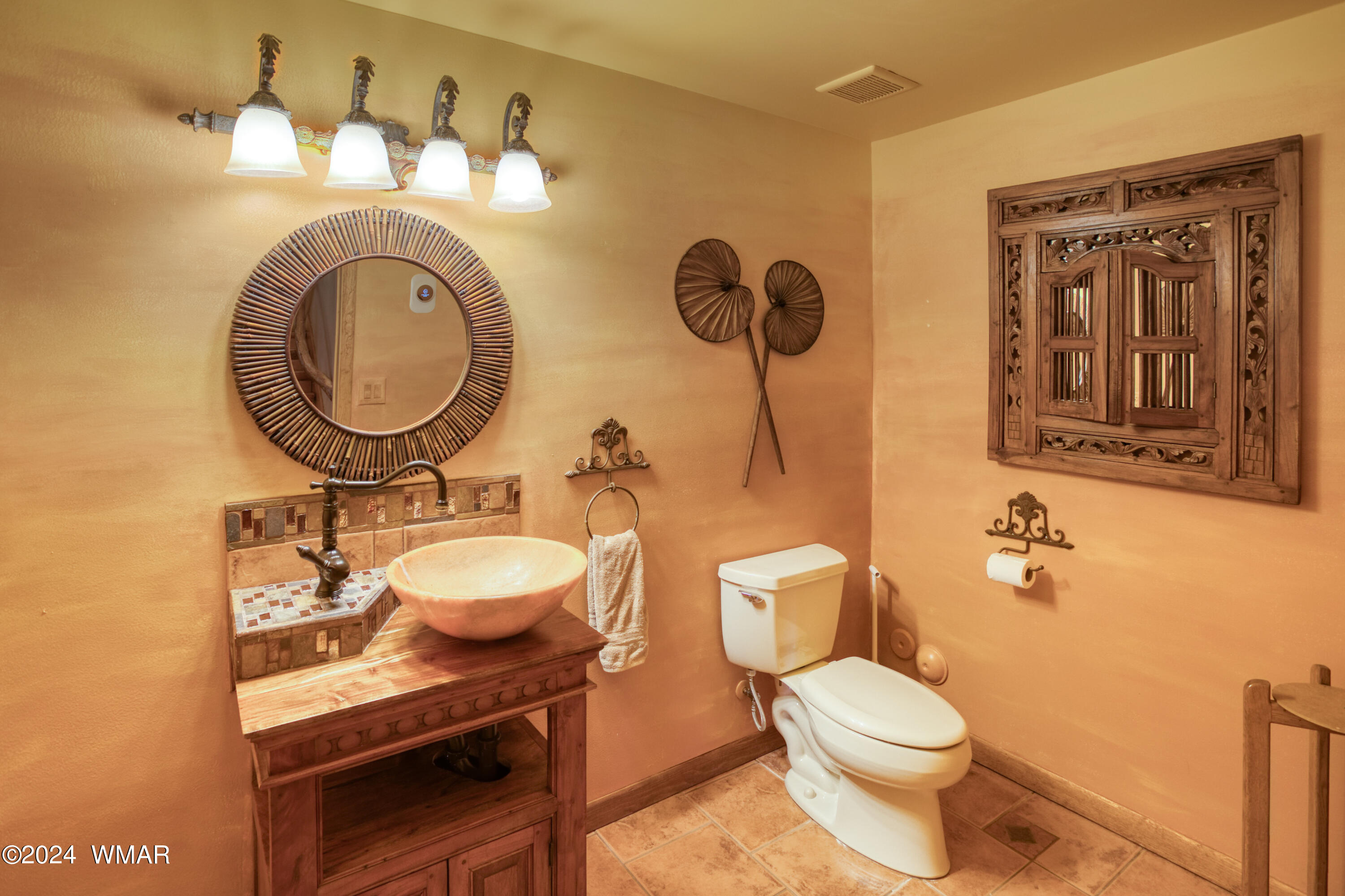 4281 Shaggy Bark Road Show Low, AZ 85901 - Photo 26 of 84 a bathroom with a toilet a sink and mirror