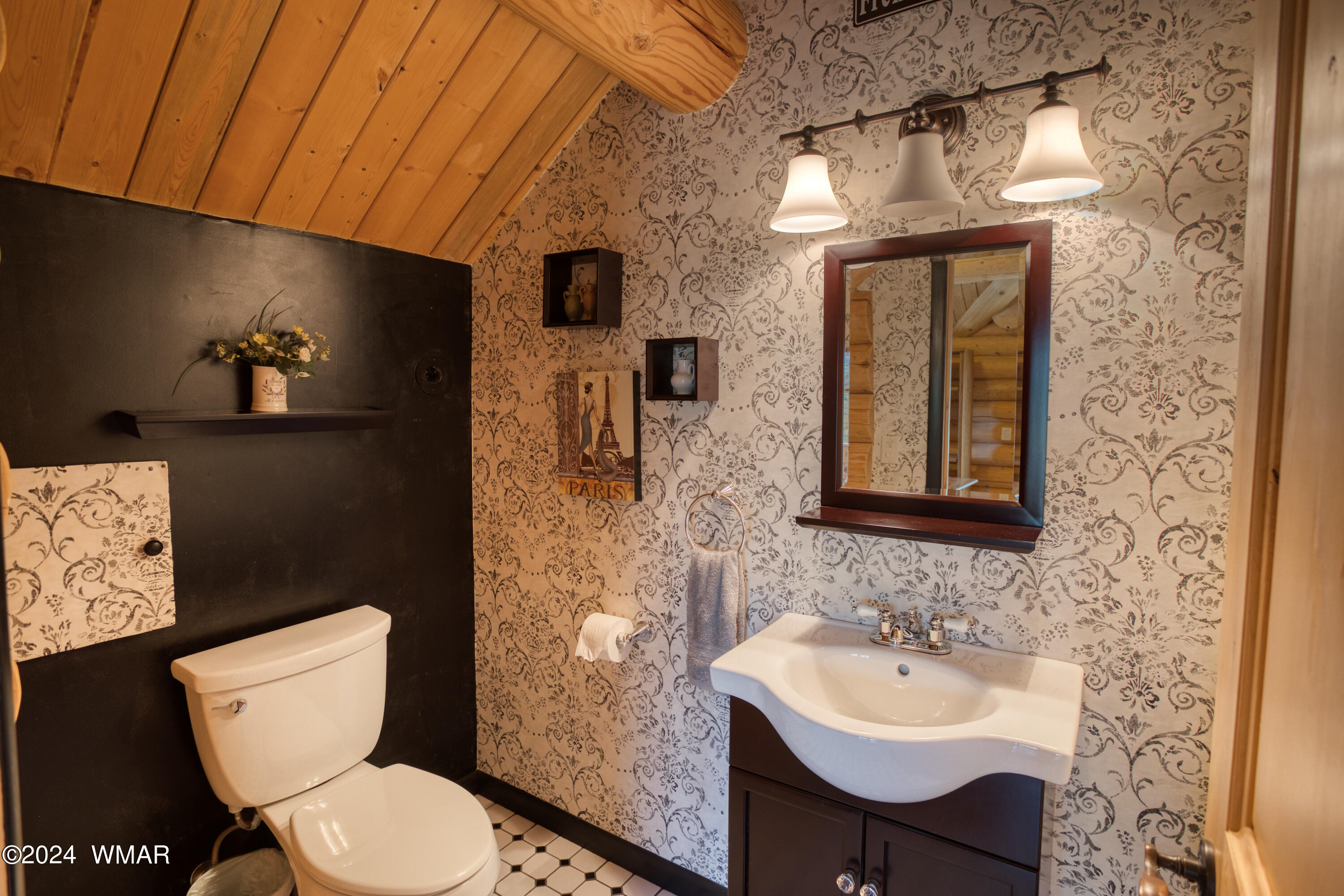 4281 Shaggy Bark Road Show Low, AZ 85901 - Photo 45 of 84 a bathroom with a toilet a sink and mirror