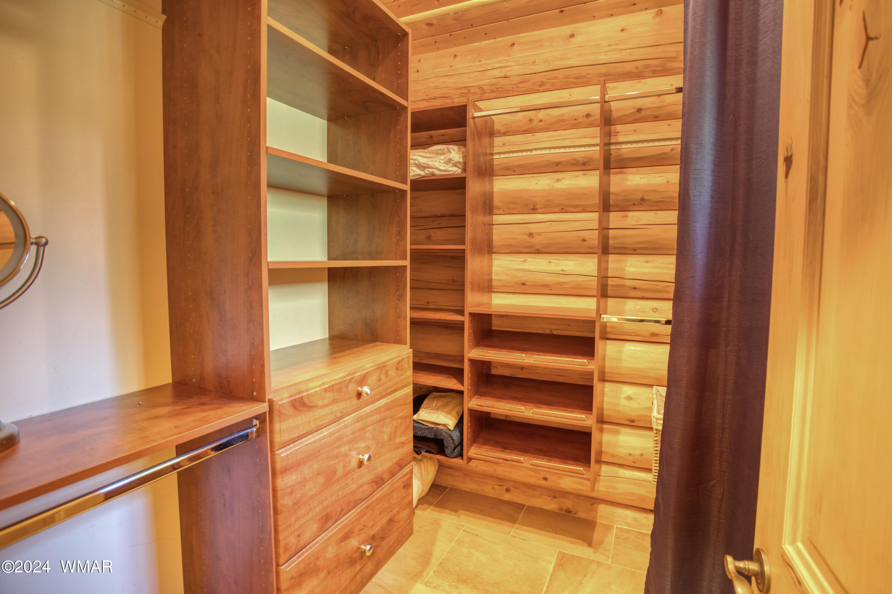 4281 Shaggy Bark Road Show Low, AZ 85901 - Photo 48 of 84 a view of walk in closet with empty racks