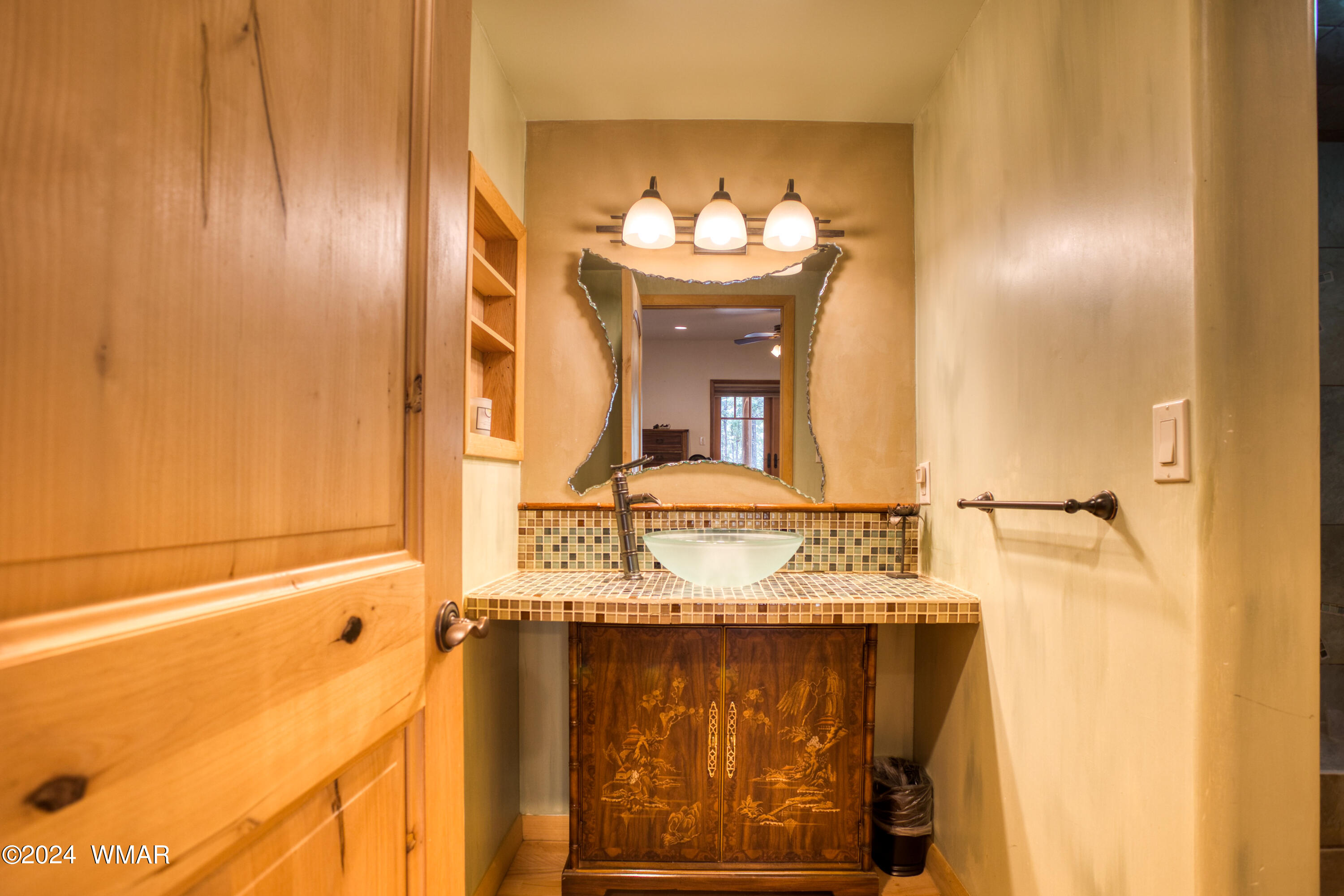 4281 Shaggy Bark Road Show Low, AZ 85901 - Photo 54 of 84 a bathroom with a sink and a mirror