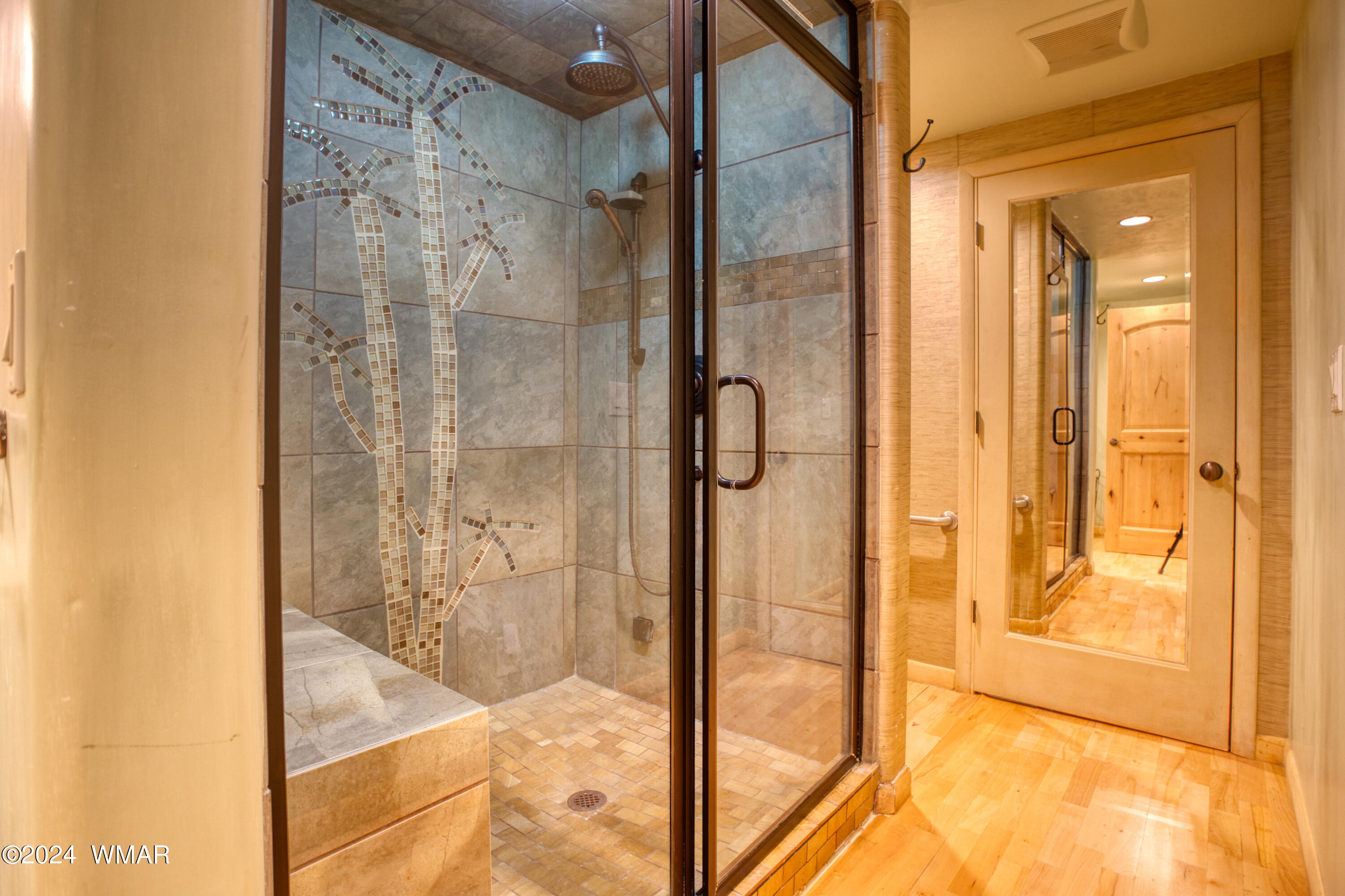 4281 Shaggy Bark Road Show Low, AZ 85901 - Photo 55 of 84 a bathroom with a glass shower door