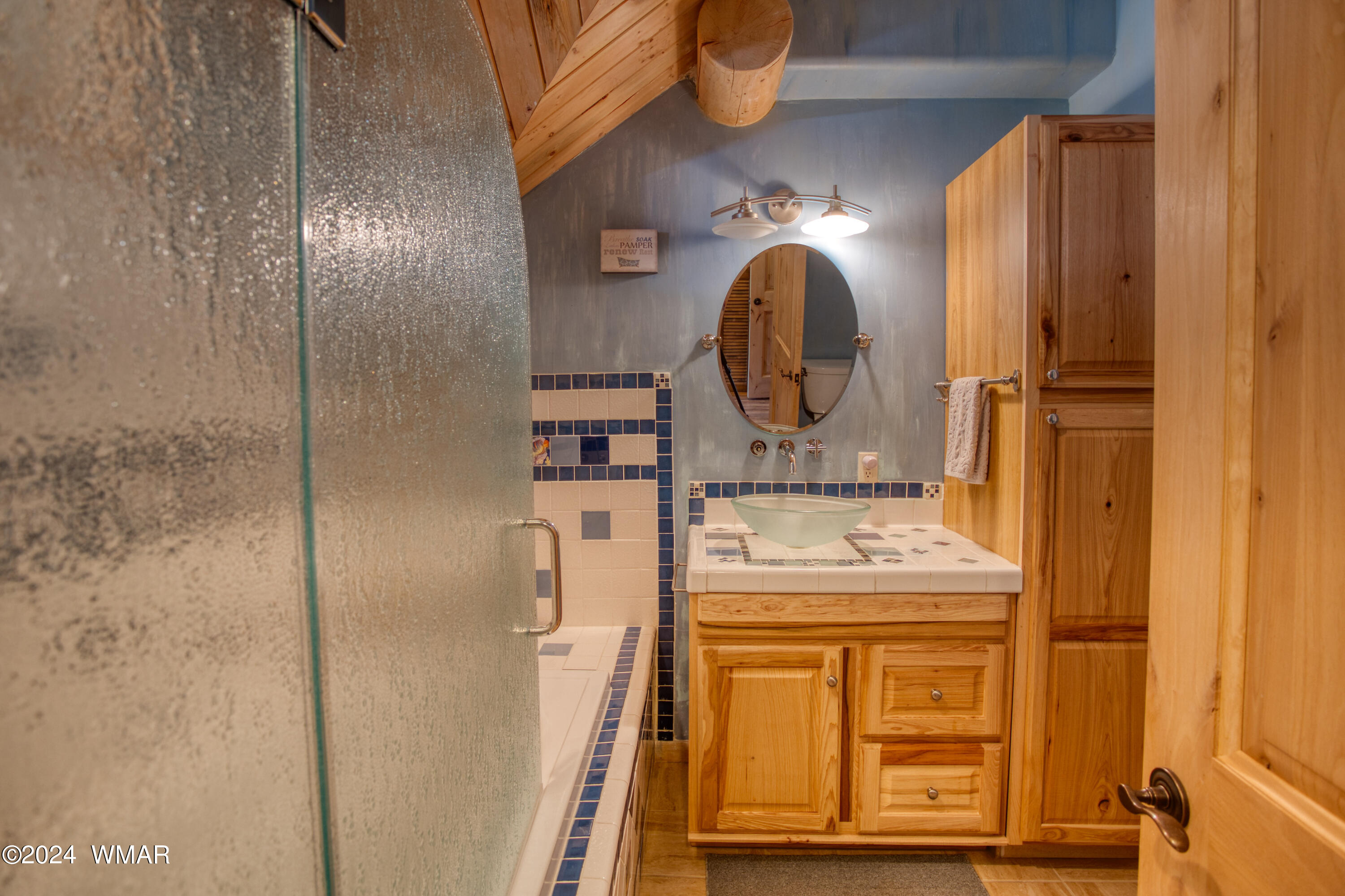 4281 Shaggy Bark Road Show Low, AZ 85901 - Photo 60 of 84 a bathroom with a sink and a mirror