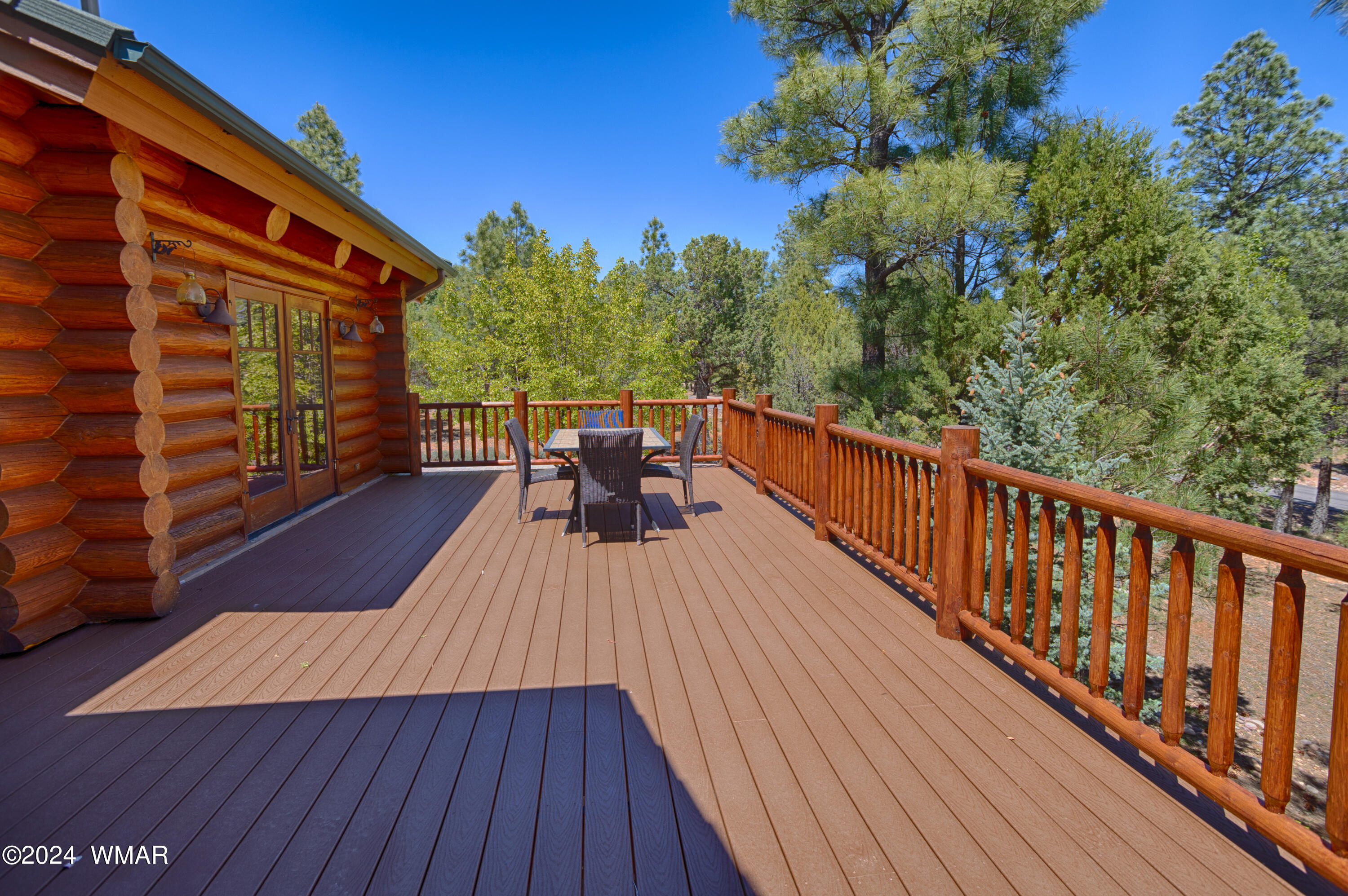 4281 Shaggy Bark Road Show Low, AZ 85901 - Photo 62 of 84 a balcony with wooden floor and outdoor seating